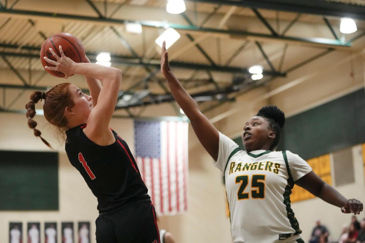 Circleville's Faith Yancey shoots over Hamilton Township’s Myke-Kila Dean during a January game. The Tigers started 24-0 and advanced to the Division II Southeast District final, but will be in Division IV next winter.