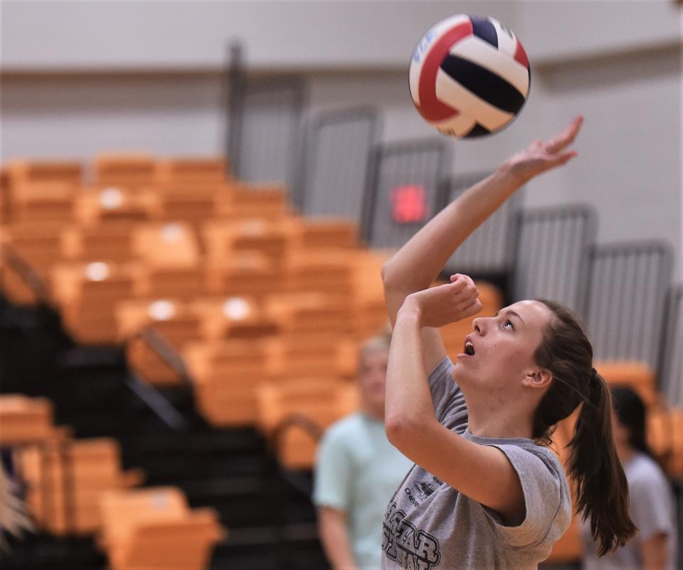 Moran grad Johnnie Hise hits the ball during practice with the North squad on Wednesday at Wylie's Bulldog Gym.