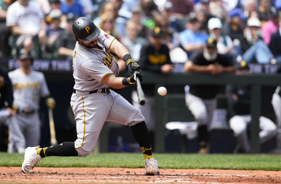 Pittsburgh Pirates' Austin Hedges hits an RBI-sacrifice fly to score Ji Hwan Bae against the Seattle Mariners during the fifth inning of a baseball game Sunday, May 28, 2023, in Seattle. (AP Photo/Lindsey Wasson)