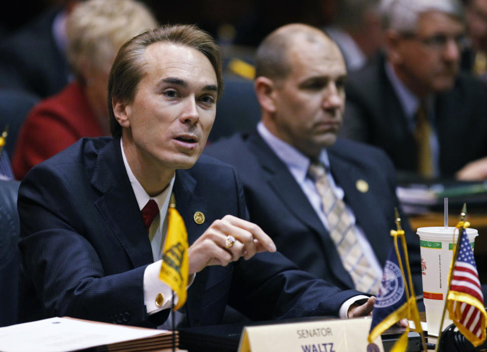 FILE - Then-Sen. Brent Waltz, R-Indianapolis, speaks during a joint committee hearing at the Statehouse in Indianapolis, Jan. 6, 2012. The former Indiana state senator was sentenced Wednesday, Aug. 17, 2022, to 10 months in prison for his role in a scheme that illegally funneled money from a casino company to his unsuccessful 2016 congressional campaign. (AP Photo/Michael Conroy, File)