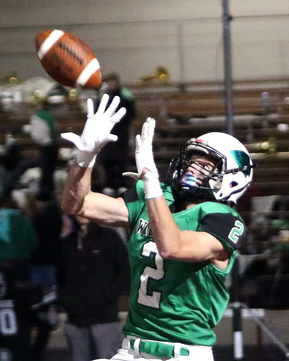 West Branch's Nick Wilson pulls in a touchdown pass during the Division IV regional final against Ursuline Friday, November 19, 2021.