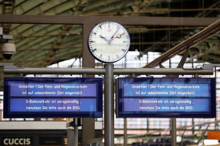 An information board informs passengers about cancelled trains caused by storm called "Herwart" at the railway station Ostbahnhof in Berlin, Germany October 29, 2017. REUTERS/Axel Schmidt
