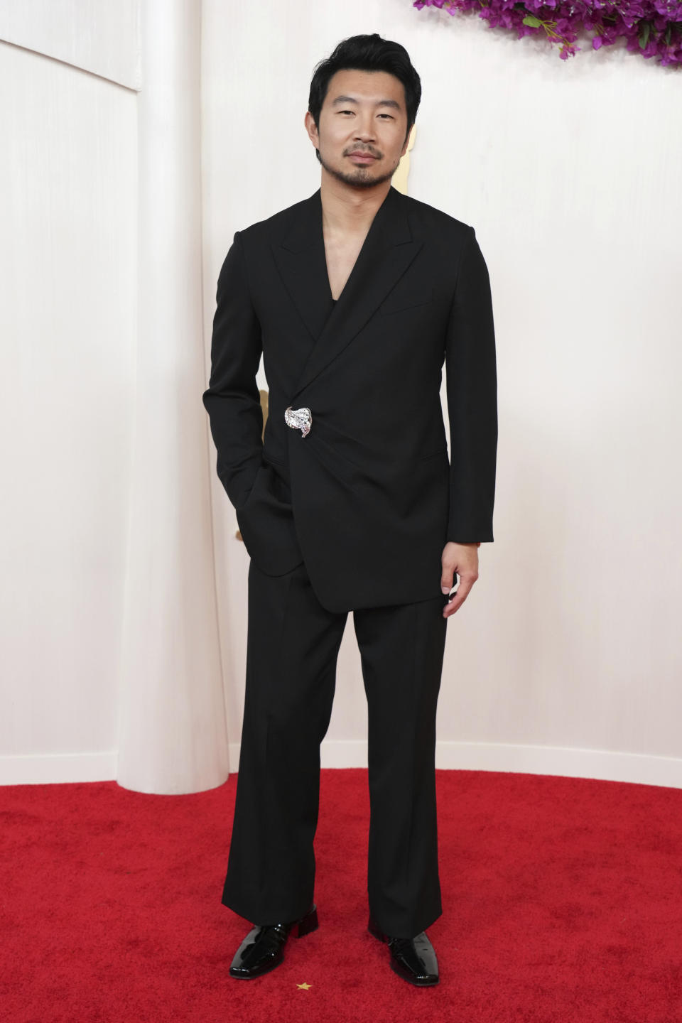 Simu Liu arrives at the Oscars on Sunday, March 10, 2024, at the Dolby Theatre in Los Angeles. (Photo by Jordan Strauss/Invision/AP)