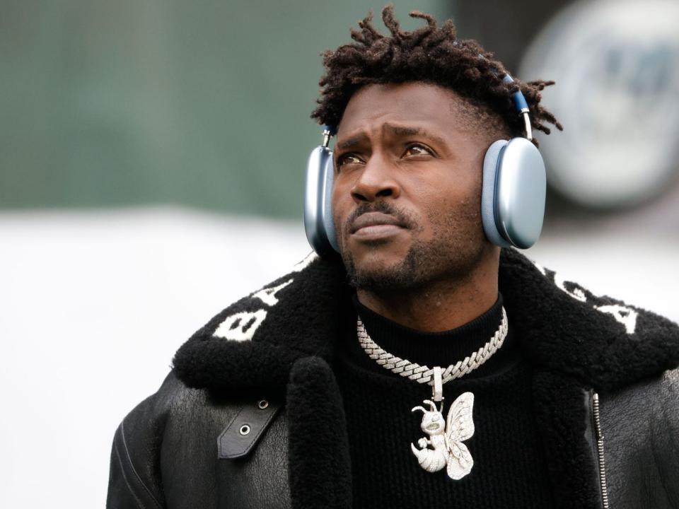 Antonio Brown walks on the field before a game.