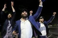 St. Louis Blues NHL hockey players Robert Bortuzo, left, Pat Maroon, center, and David Perron greet fans after arriving at the airport in St. Louis early Thursday, June 13, 2019. The Blues defeated the Boston Bruins 4-1 in Game 7 of the Stanley Cup finals to win their first NHL championship Wednesday night in Boston. (Colter Peterson/St. Louis Post-Dispatch via AP)