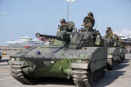 FILE PHOTO: Swedish armoured personnel carriers are seen in Visby harbour, island of Gotland, Sweden September 14, 2016. TT News Agency/ Soren Andersson/ via REUTERS