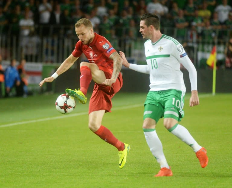 Michal Kadlec of Czech Republic (L) fights for the ball with Kyle Lafferty of Northern Ireland during their 2018 World Cup qualification match, in Prague, on September 4, 2015