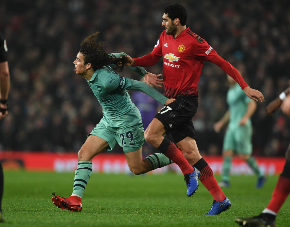 Marouane Fellaini escaped a card for pulling Matteo Guendouzi’s hair at Old Trafford