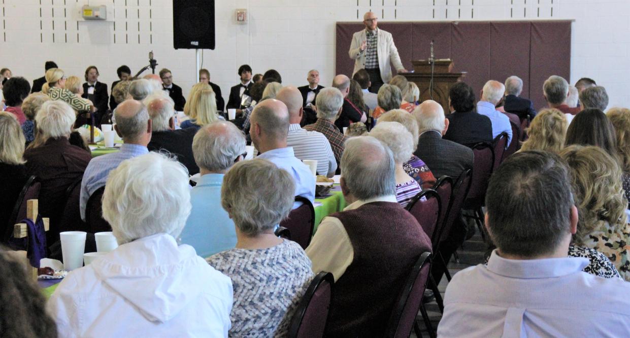 A large crowd filled the gym at First Central Presbyterian Church on Monday for the first Holy Week sermon, given by First Baptist's senior pastor Brandon Hudson.