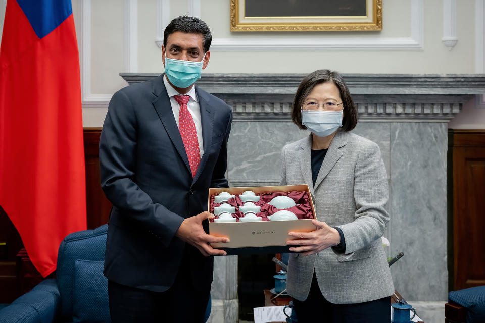 In this photo released by the Taiwan Presidential Office, Taiwan's President Tsai Ing-wen exchanges gift with California Rep. Ro Khanna during a meeting at the Presidential Office in Taipei, Taiwan on Tuesday, Feb. 21, 2023. A delegation of U.S. lawmakers led by Khanna on Tuesday met with Taiwan's president, who promised to deepen military cooperation between the two sides despite objections from China, which claims the island as its own territory. (Taiwan Presidential Office via AP)