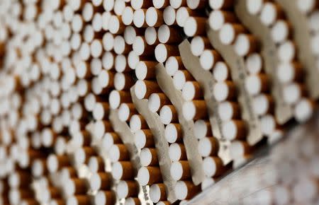 Cigarettes are seen during the manufacturing process in the British American Tobacco Cigarette Factory (BAT) in Bayreuth, southern Germany, in this April 30, 2014 file photograph. REUTERS/Michaela Rehle /Files