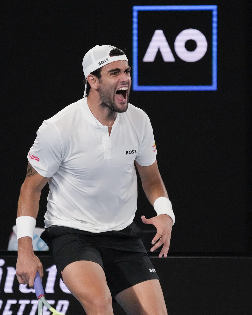 Matteo Berrettini of Italy reacts after winning a point against Andy Murray of Britain during their first round match at the Australian Open tennis championship in Melbourne, Australia, Tuesday, Jan. 17, 2023. (AP Photo/Aaron Favila)