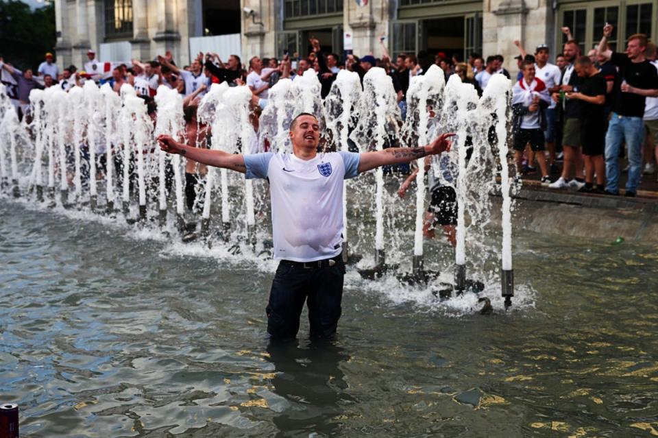 An England fan revels in a water fountain during Euro 2016 (Getty Images)