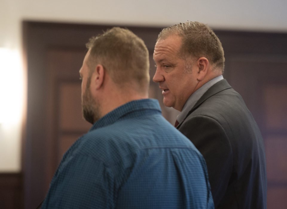 Jeremiah Allen, left, stands in Portage County Common Pleas Court before Visiting Judge Thomas Pokorny on Friday, Jan. 26, 2024, with his attorney, Troy Reeves.