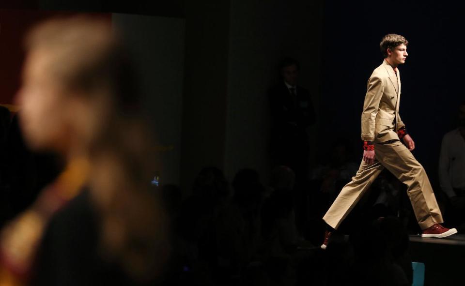 A model wears a creation for Prada men's Spring-Summer 2014 collection, part of the Milan Fashion Week, unveiled in Milan, Italy, Sunday, June 23, 2013. (AP Photo/Luca Bruno)