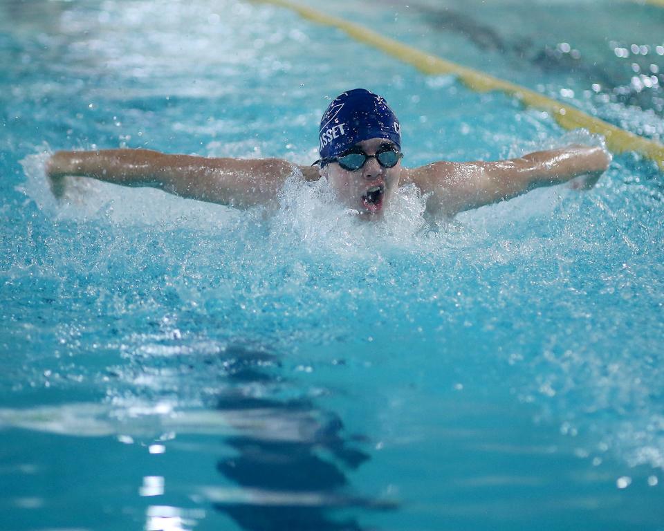Cohasset’s Jack DeMello flys out of the water during the 100 yard butterfly during their league meet against Norwell at the Connell Pool in Weymouth on Saturday, Jan. 22, 2022. 