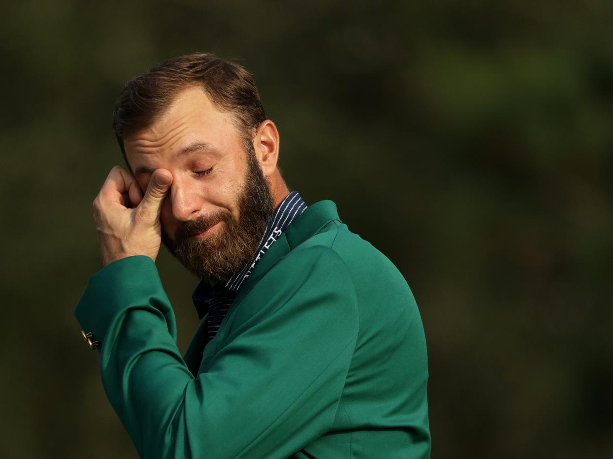 <p>Dustin Johnson tears up during his acceptance speech</p> (Getty Images)