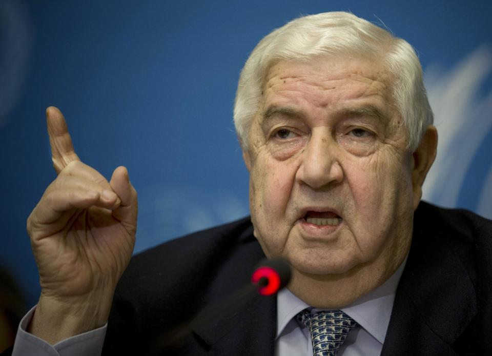 FILE - In this file photo taken Friday, Jan. 31, 2014, Syria's Foreign Minister and head of the Syrian government delegation Walid al-Moallem gestures during a press conference at the United Nations headquarters in Geneva, Switzerland. Lebanese security officials said Friday, March 14, that Syrian Foreign Minister Walid al-Moallem has been rushed to a Beirut hospital and is undergoing treatment there. The officials didn’t say when al-Moallem was brought to the American University of Beirut Medical Center. (AP Photo/Anja Niedringhaus, File)