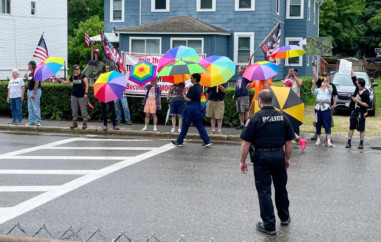Supporters of the Small Town Pride celebration used rainbow umbrellas to block protesters at the 2023 event in North Brookfield.
