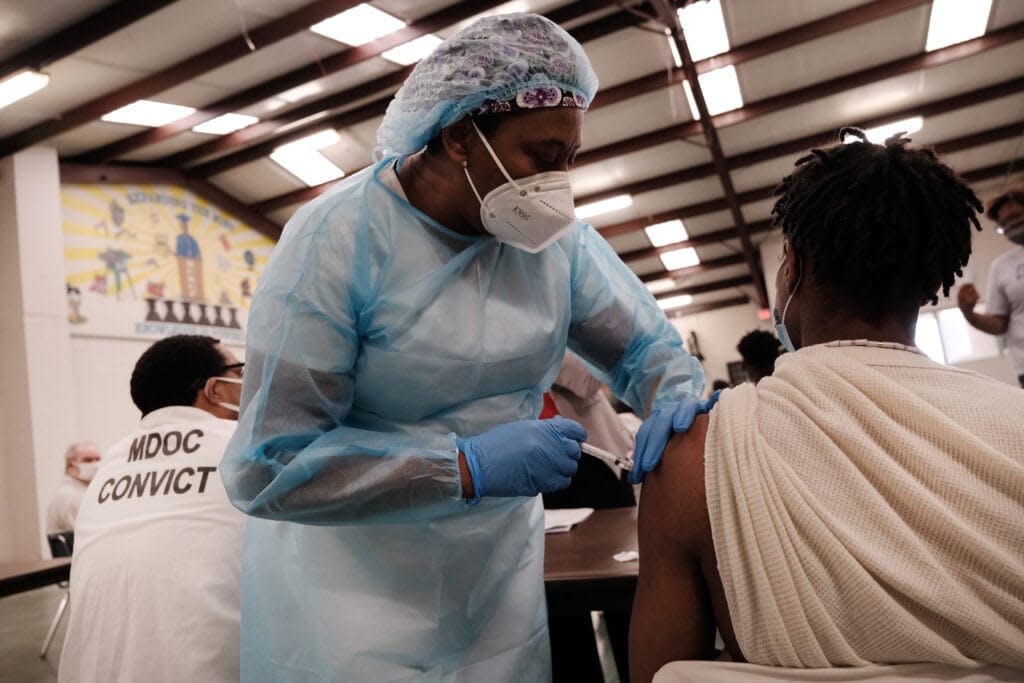 A prisoner at the Bolivar County Correctional Facility receives a Covid-19 vaccination administered by medical workers with Delta Health Center on April 28, 2021 in Cleveland, Mississippi. (Photo by Spencer Platt/Getty Images)