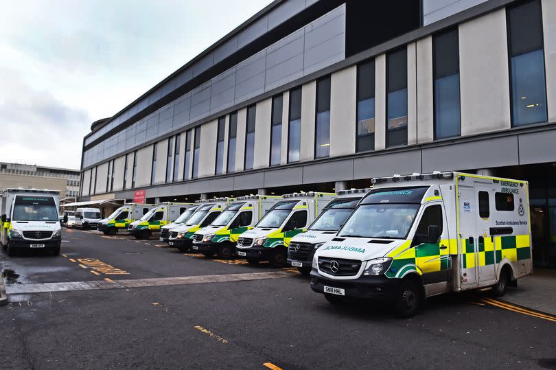 Ambulances queued outside the Queen Elizabeth University Hospital have been a sign of A& E chaos for years -Credit:Tony Nicoletti