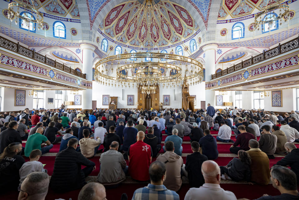 Muslims take part in Friday prayers at the Merkez DITIB mosque in Duisburg, Germany, Friday, Oct. 13, 2023. (Christoph Reichwein/dpa via AP)
