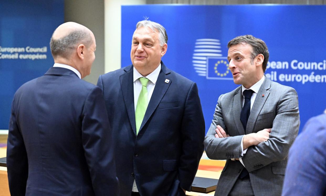 <span>Hungarian PM Viktor Orbán (centre) and French president Emmanuel Macron (right) at the summit. The agreement was made after wording was tweaked to address opposition by Hungary.</span><span>Photograph: Anadolu/Getty Images</span>