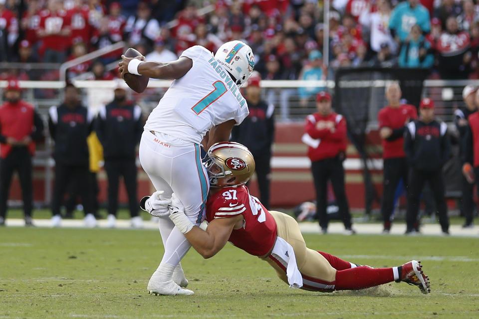 San Francisco 49ers defensive end Nick Bosa (97) sacks Miami Dolphins quarterback Tua Tagovailoa (1) during the first half of an NFL football game in Santa Clara, Calif., Sunday, Dec. 4, 2022. (AP Photo/Jed Jacobsohn)