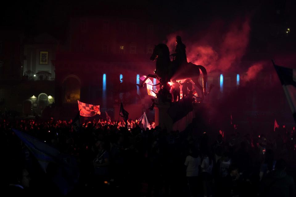 Napoli fans celebrate after winning the Italian league soccer title, in Naples, Italy, Thursday, May 4, 2023. Napoli won its first Italian soccer league title since the days when Diego Maradona played for the club, sealing the trophy with a 1-1 draw at Udinese on Thursday. (AP Photo/Andrew Medichini)