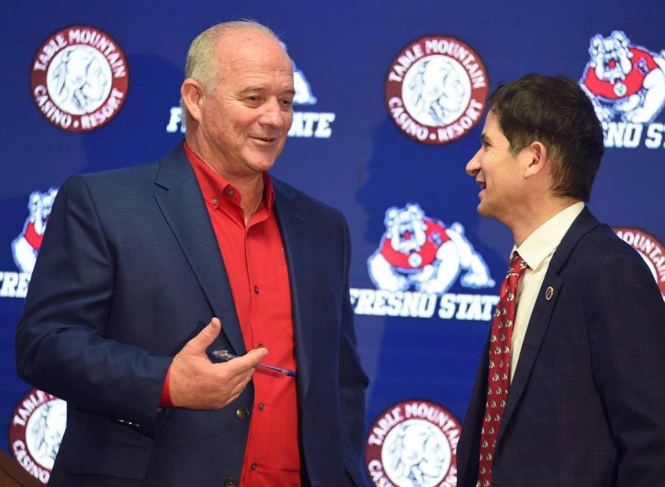 New Fresno State football coach Jeff Tedford talks with university President Saúl Jiménez-Sandoval after a press conference where he was welcomed back to the team, Wednesday Dec. 8, 2021.