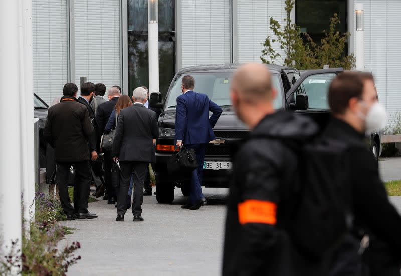 Members of a U.S. delegation arrive after a break in front of the Hyatt Regency Zurich Airport hotel in Zurich