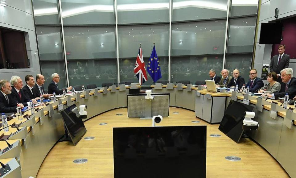 Michel Barnier (right) and David Davis (second from left) lead their teams as Brexit talks open in Brussels.