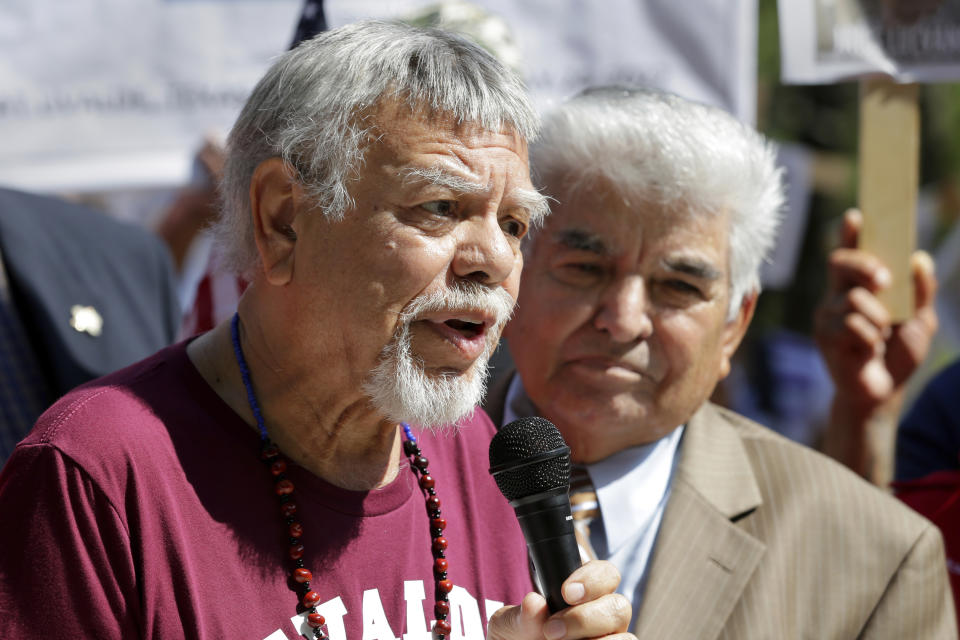 Tejano singer Little Joe, left, with Little Joe y la Familia, speaks next to Houston civil rights activist Johnny Mata, right, during a press conference by the League of United Latin American Citizens outside of the National Rifle Association's annual meeting held at the George R. Brown Convention Center, Friday, May 27, 2022, in Houston. (AP Photo/Michael Wyke)