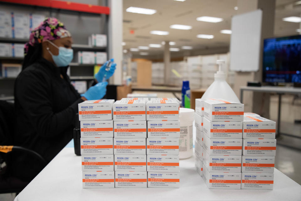 Boxes of Regeneron products sit stacked on a table inside a Tallahassee, Florida, monoclonal antibodies distribution operation at the Governor's Square Mall on Sept. 20, 2021.