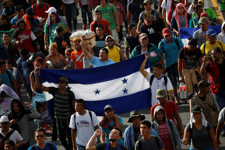 Central American migrants walk along the highway near the border with Guatemala, as they continue their journey trying to reach the U.S., in Tapachula, Mexico October 21, 2018. REUTERS/Ueslei Marcelino