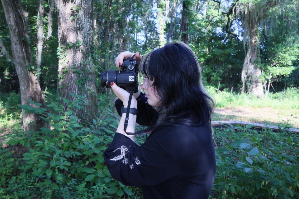 Sidney Peters, 2023 Summer Youth participant, takes a photo of the County’s J.R. Alford Greenway Mountain Bike Progressive Skills Course.