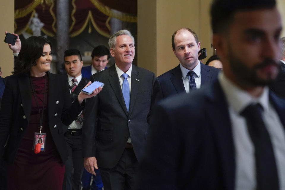 House Speaker Kevin McCarthy of Calif., speaks with members of the press as he walks to the House floor on Capitol Hill in Washington, Wednesday, Jan. 11, 2023. (AP Photo/Patrick Semansky)