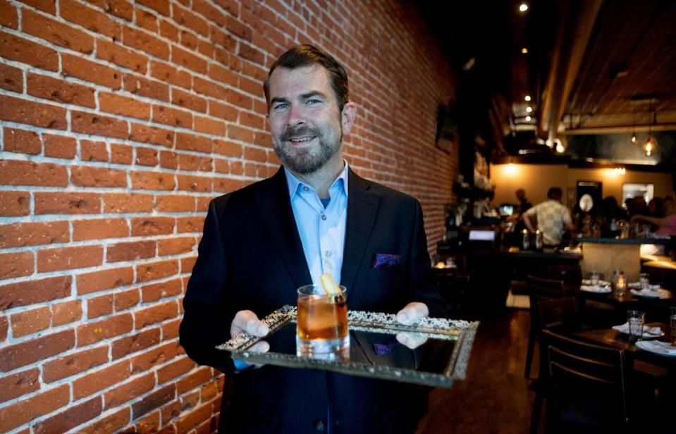 La Cosecha’s general manager Ben Meyer holds a specialty cocktail on a mirrored tray. The restaurant in downtown Paso Robles recently had a change of ownership and has a new menu featuring Spanish and Peruvian food. Laura Dickinson/ldickinson@thetribunenews.com