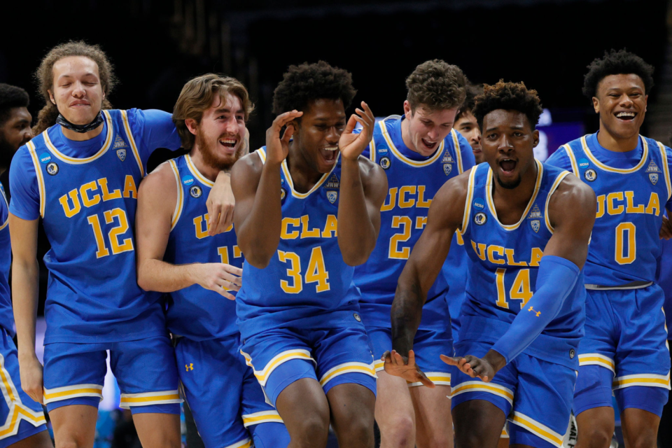 UCLA players celebrate their Sweet 16 victory over Alabama on March 28.