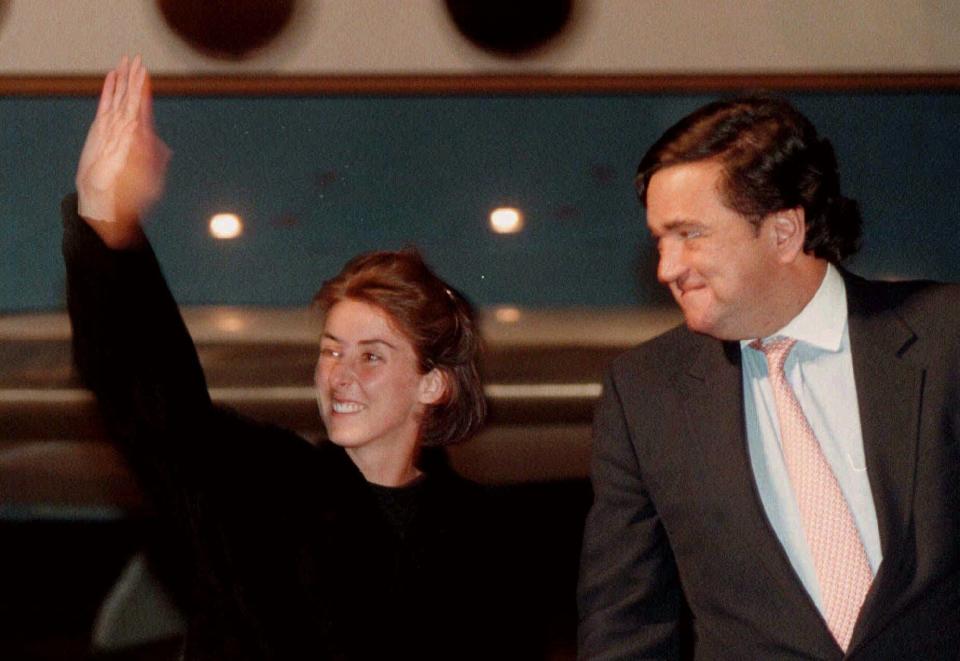 Australian nurse Maree Worthington, left, waves as she arrives at the Geneva airport accompanied by then Rep. Bill Richardson in this Dec. 9, 1996 file photo. Worthington was released with two other workers from the International Committee of the Red Cross after five weeks in captivity by rebels in southern Sudan.