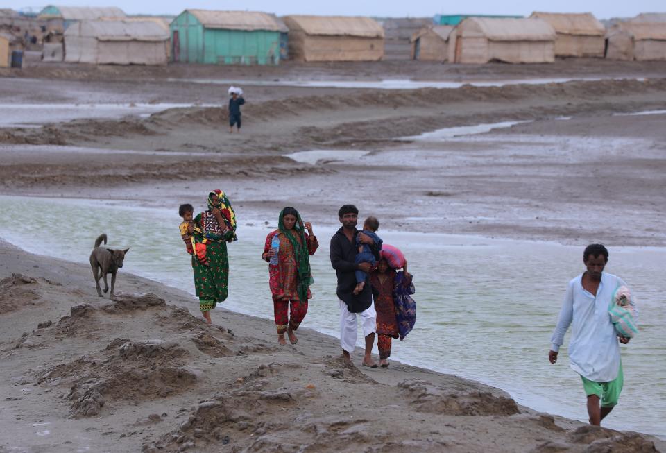 People flee the coastal areas following warnings of Cyclone Biparjoy in Keti Bandar, Sindh Province, Pakistan (EPA)