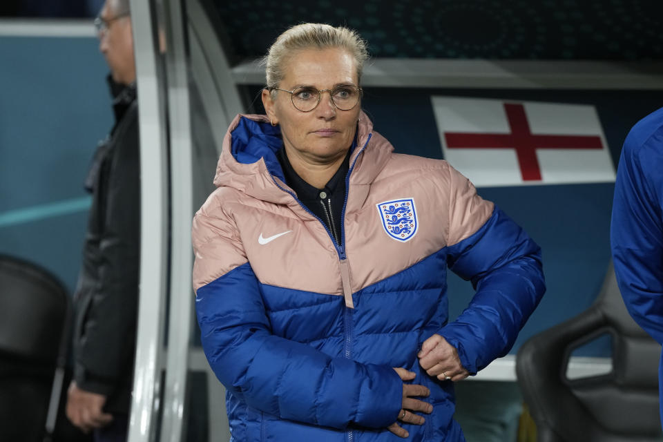 England's head coach Sarina Wiegman stands by the bench before the start of the Women's World Cup quarterfinal soccer match between England and Colombia at Stadium Australia in Sydney, Australia, Saturday, Aug. 12, 2023. (AP Photo/Rick Rycroft)