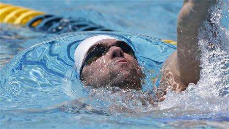 Apr 23, 2014; Mesa, AZ, USA; Michael Phelps swims laps his first official practice session for the Arena Grand Prix swim meet at Skyline Aquatic Center. Rob Schumacher-USA TODAY Sports