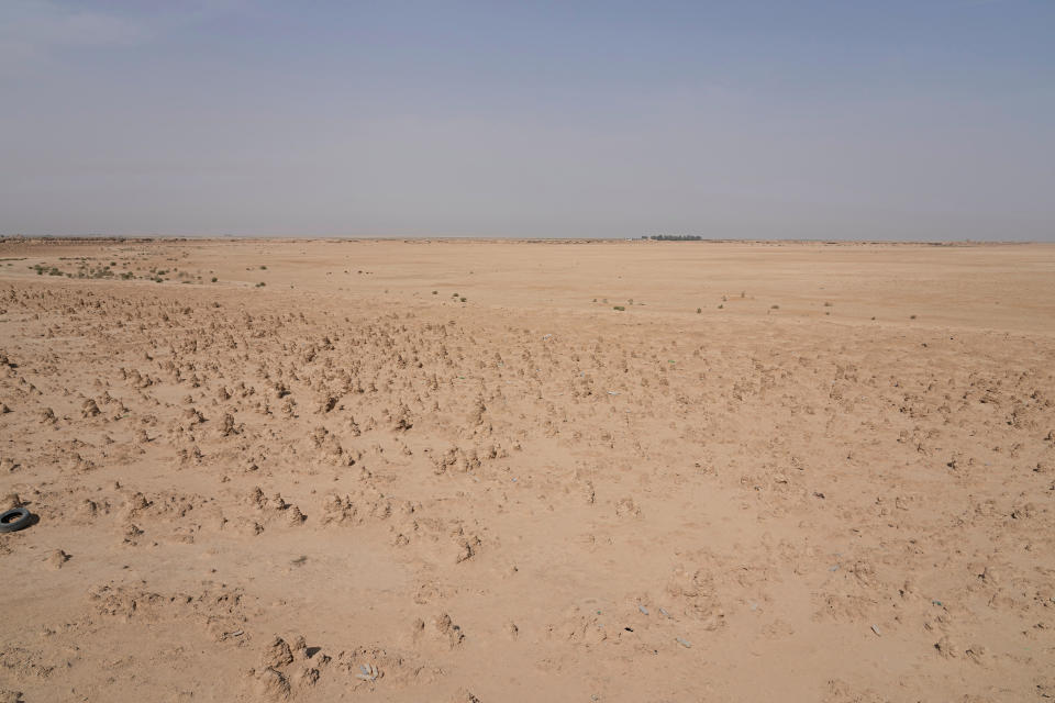 A general view of the dried up Lake Sawa Iraq, is seen Saturday, June 4, 2022. This year, for the first time in its centuries-long history, Sawa Lake dried up completely. A combination of mismanagement by local investors, government neglect and climate change has ground down its azure shores to chunks of salt. (AP Photo/Hadi Mizban)