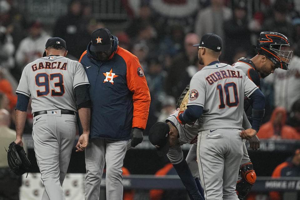 Houston Astros manager Dusty Baker Jr. takes relief pitcher Yimi Garcia out of the game during the sixth inning in Game 3 of baseball's World Series between the Houston Astros and the Atlanta Braves Friday, Oct. 29, 2021, in Atlanta. (AP Photo/Brynn Anderson)