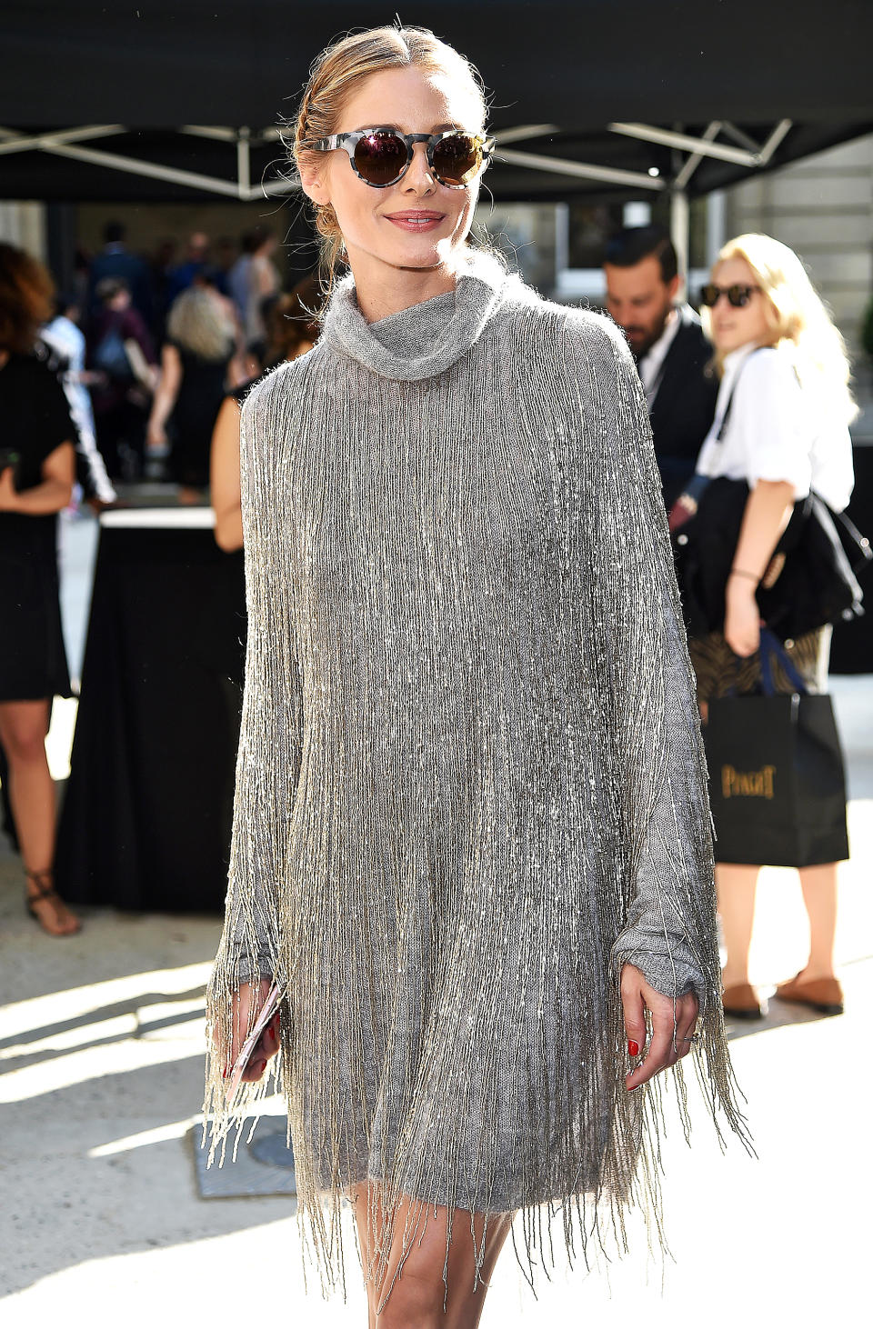 <p>What do you wear when you're Olivia Palermo and you've already made it clear that you <em>own</em> both the fringe trend and the turtleneck trend? A sparkly, high fashion version of both! (It's worth noting that the runway version of this Valentino dress had the shiny fringe extending all the way to the calves, so this is less dramatic by comparison.)</p>