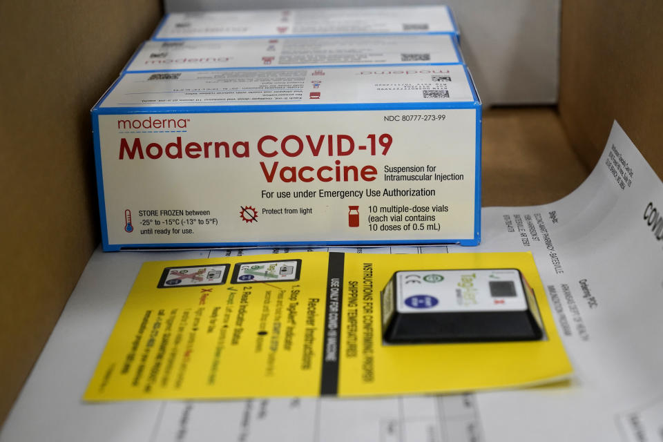 Boxes containing the Moderna COVID-19 vaccine are prepared to be shipped at the McKesson distribution center in Olive Branch, Miss., Sunday, Dec. 20, 2020. (AP Photo/Paul Sancya, Pool)