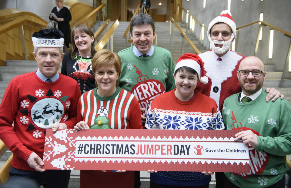 <p>Leaders of the Scottish political parties, (back row, from the left) Maree Todd, Presiding Officer Ken Macintosh, Anas Sarwar and (front row, from the left) Willie Rennie, Nicola Sturgeon, Ruth Davidson and Patrick Harvey, wear their Christmas jumpers at a photocall at the Parliament at Holyrood, Edinburgh. (PA) </p>