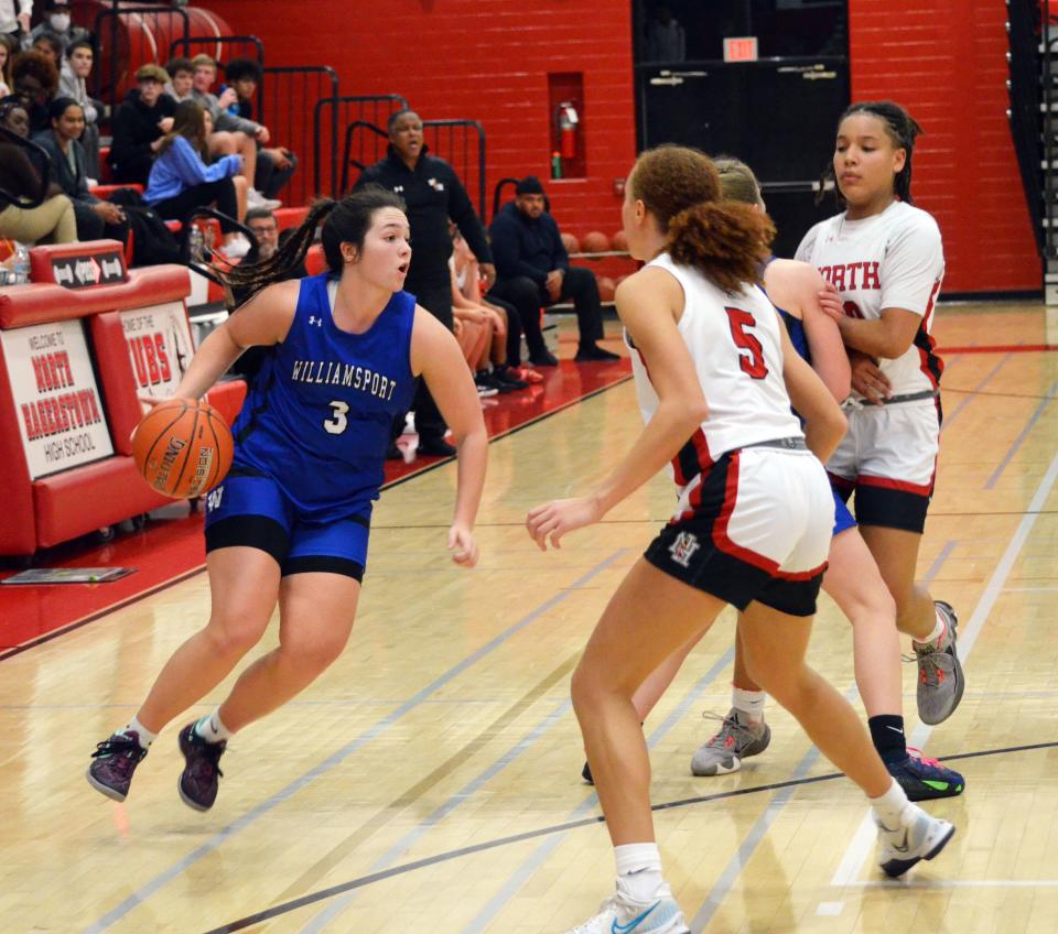 Williamsport's Paige Smith (3) looks to drive against North Hagerstown's Kayla Turner (5) during the Wildcats' 46-38 victory.