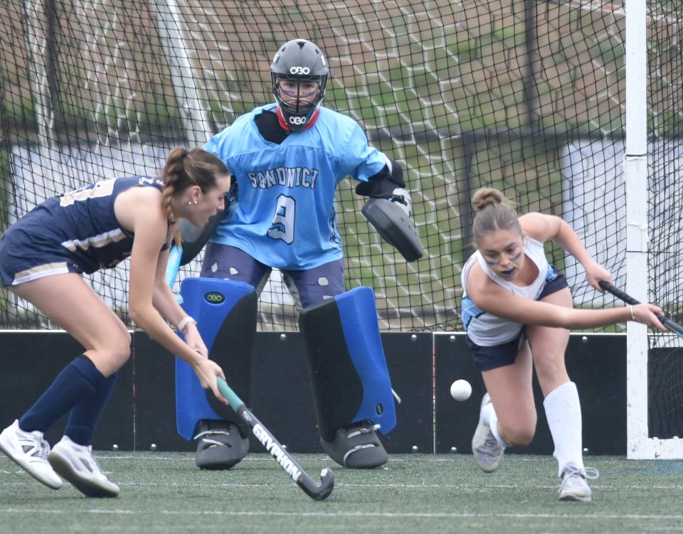 SANDWICH --11/10/23 -- Sandwich goalie Avery Cobban protects the net as teammate Abigail Cotter, right, clears the ball as Sandwich hosted Foxborough in tournament field hockey action on Friday afternoon. Sandwich won in overtime, 2-1.